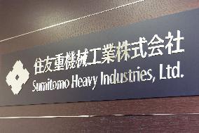 Sumitomo Heavy Industries signboard and logo